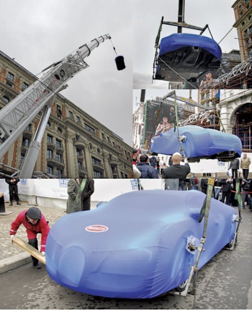 Огромный кран спустил Veyron с крыши отеля…