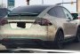 Владелец Tesla Model X покрыл кузов машины 14 тысячами монет