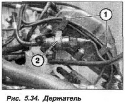 Освободить держатель (1, рис. 5.34) провода…