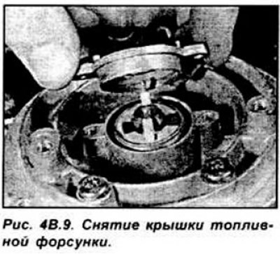 Отогните фиксаторы и отвинтите болты крепления…