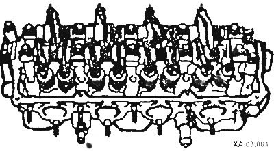 Уберите прокладку передней трубы глушителя и прокладку головки цилиндров.