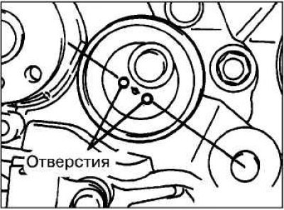 Установите и временно закрепите ролик натяжителя…