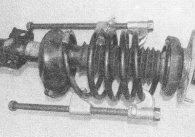 Рис. 4.3. Установите компрессоры пружин и сожмите…